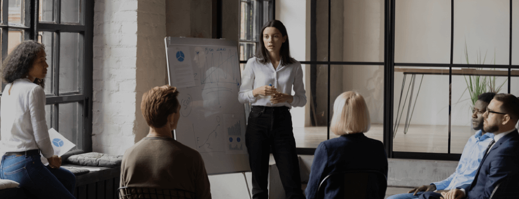 Several people in a meeting, representing discussions and planning for the ProWein 2023 event in Düsseldorf