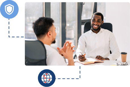 Two professionals smiling in a meeting, highlighting the teamwork and expertise of a recruitment agency specializing in international hiring.